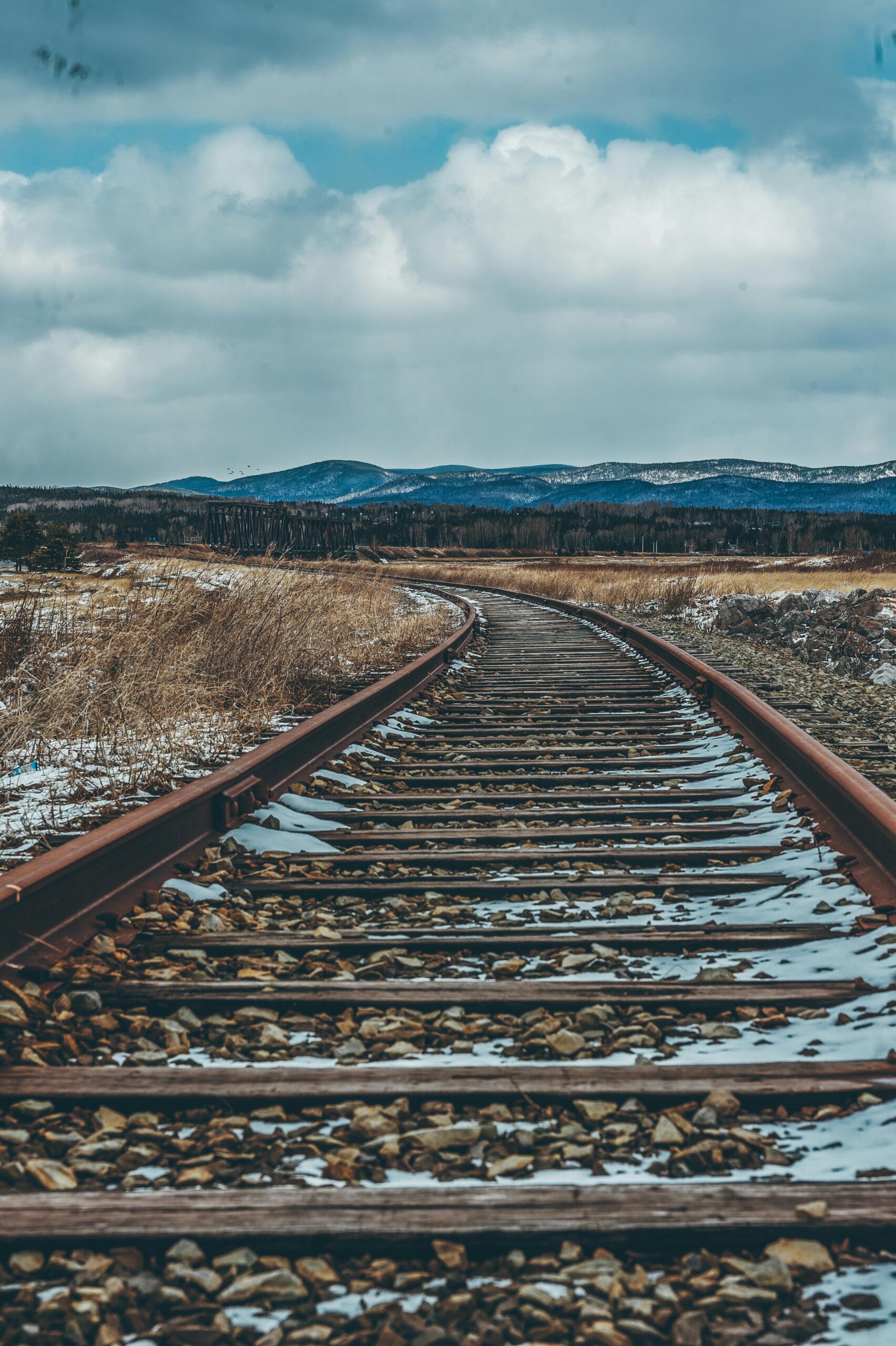 Photo by Harrison Haines: https://www.pexels.com/photo/photo-of-brown-railroad-2869644/